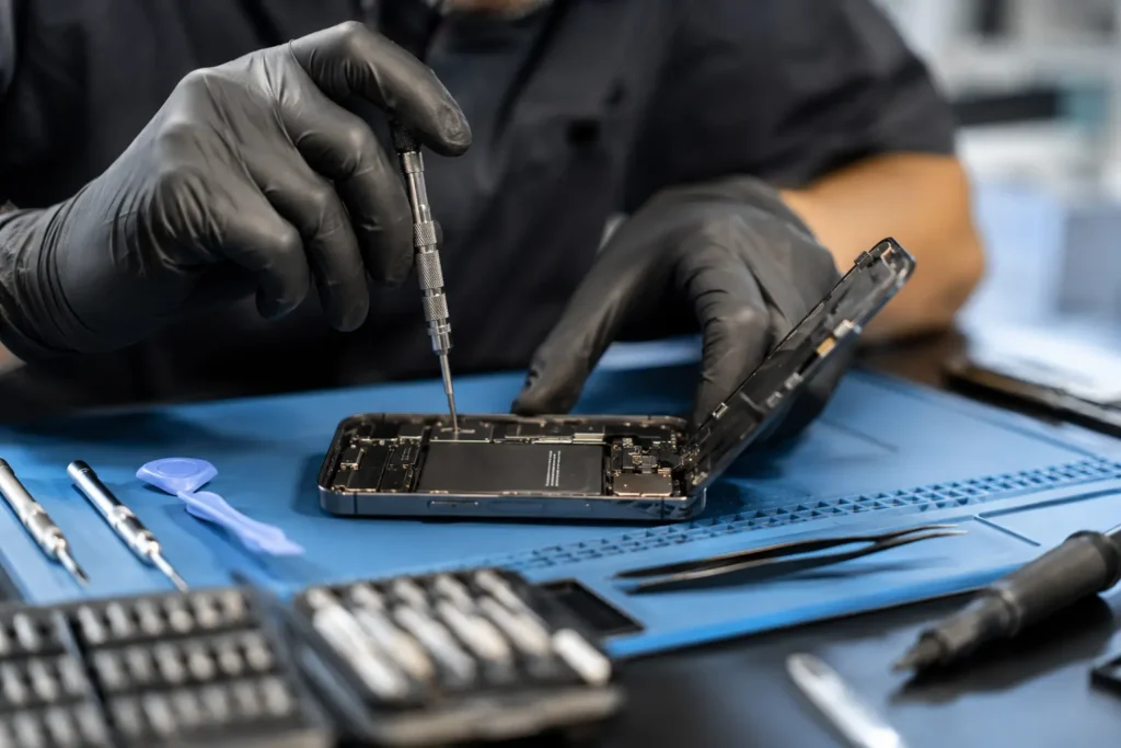 Certified technician repairing phone screen in-store